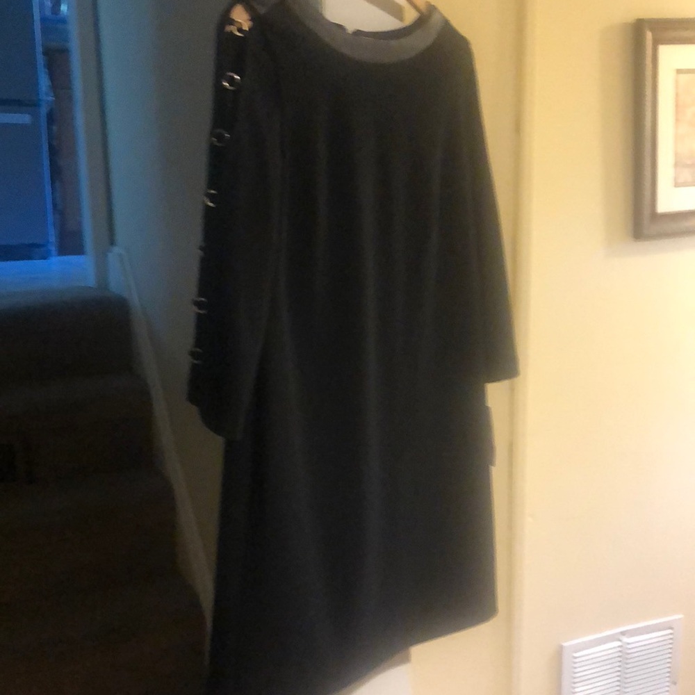 Donna Ricco black dress. Size 8 leather like collar and peekaboo sleeves .